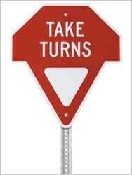 Gary Lauder's Take Turns sign. (Photo from the New York Times Wheels blog.)