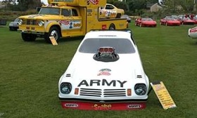 Don Prudhomme's Army sponsored Vega funny car was one of the cars he had on display. In back is the famous Hot Wheels Dodge transporter and funny car. (Photo by Patrick C. Paternie.)