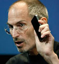 Apple CEO Steve Jobs holds up iPhone 4 as he talks about the Apple iPhone 4 at Apple headquarters in Cupertino, Calif., Friday, July 16, 2010  (© Paul Sakuma/AP)