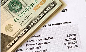 The percentage of Americans who are current on their credit card bills but delinquent on their mortgage payments is growing. (© Nick M Do/Getty Images)