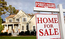 The number of households that received a foreclosure filing in April is down 2% from April 2009. (© Ariel Skelley/Getty Images)