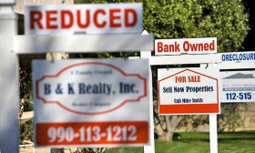 Foreclosure activity fell 3% in May despite banks seizing a record number of homes. (© moodboard/Corbis)