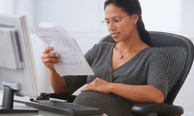 Pregnancy can affect a family's chances at getting a mortgage. (© SuperStock)