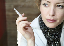 Woman smoking © Corbis