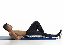 Man performing the McGill Curlup exercise